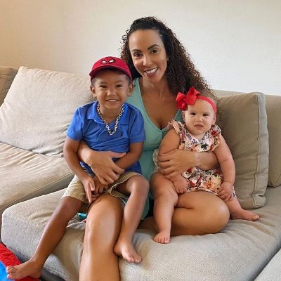 Jodi Stewart is holding Remi Leigh Henriques and Levi Blaze in the picture.
